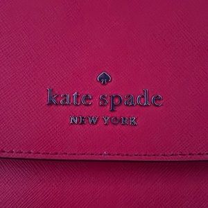 brand new Kate spade purse, colored red. Convertible crossbody .
